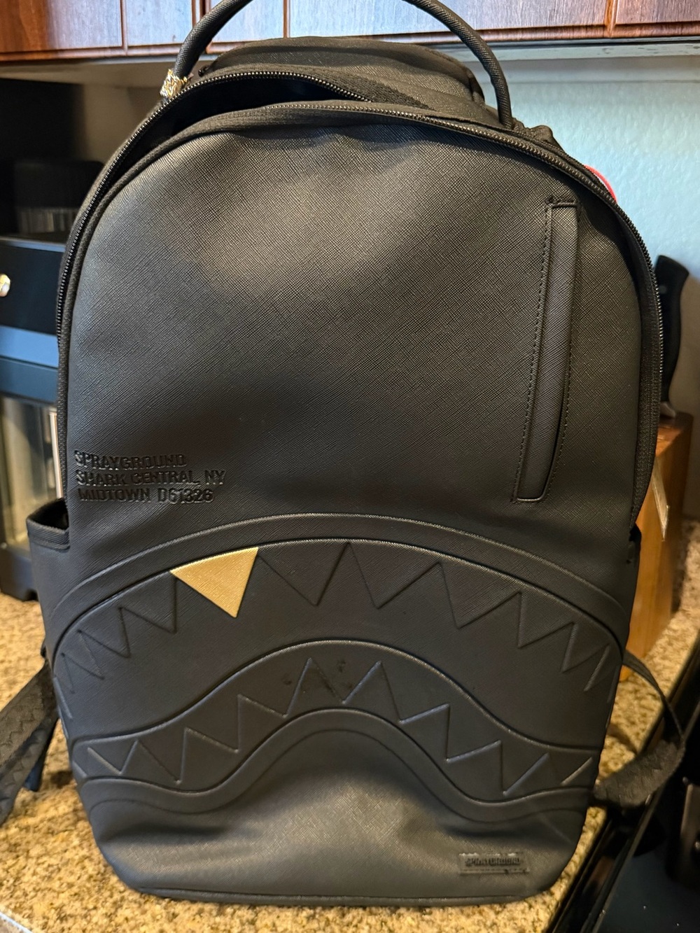 Sprayground Black Backpack with Gold Accent Shark Detail